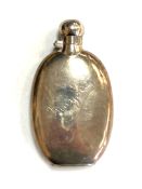 An antique silver hip flask,