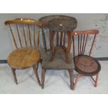 A carved beech two-tier plant stand together with three rail back chairs.