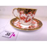 A Royal Crown Derby Imari Scissors pattern coffee cup and saucer set.