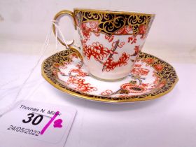 A Royal Crown Derby Imari Scissors pattern coffee cup and saucer set.