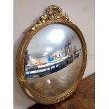 A 20th century circular gilt framed convex mirror