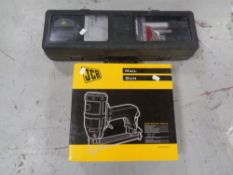 A JCB nail gun (boxed) together with a cased laser level kit