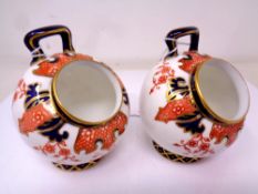 A Pair of Royal Crown Derby Imari Fern pattern salt pigs, height 9 cm.