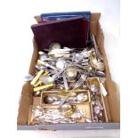 A box containing large quantity of boxed and unboxed table cutlery to include knives, teaspoons,