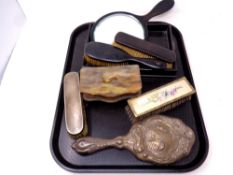 A tray containing a five piece ebony dressing table set together with further dressing table pieces