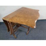 A Victorian walnut Sutherland table