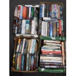 Four boxes containing a good selection of hard backed books, novels to include David Jackson,