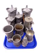 A tray containing ten pieces of antique and later pewter to include measuring jug, tankards,