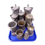 A tray containing ten pieces of antique and later pewter to include measuring jug, tankards,