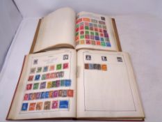 Two 20th century stamp albums containing a quantity of antiquarian and later world stamps