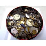 A tin containing a quantity of assorted watches and pocket watches, cases,