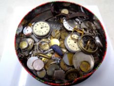 A tin containing a quantity of assorted watches and pocket watches, cases,