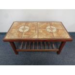 A rectangular teak tile topped coffee table