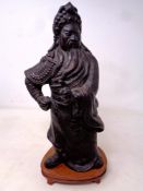 A patinated metal figure of Chinese warrior