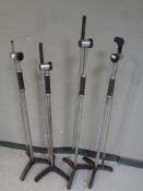 Four microphone stands.