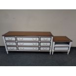 A contemporary nine drawer sideboard together with matching lamp table