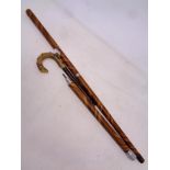 An early 20th century sectional walking stick with internal fountain pen and pencil.
