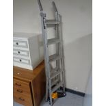 A set of Abru aluminium 3-in-1 ladders together with a JCB hand held vacuum.