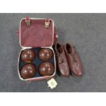 A Taylor Lawn bowls bag containing Henselite lawn bowls, shoes and accessories.