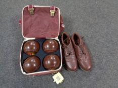 A Taylor Lawn bowls bag containing Henselite lawn bowls, shoes and accessories.