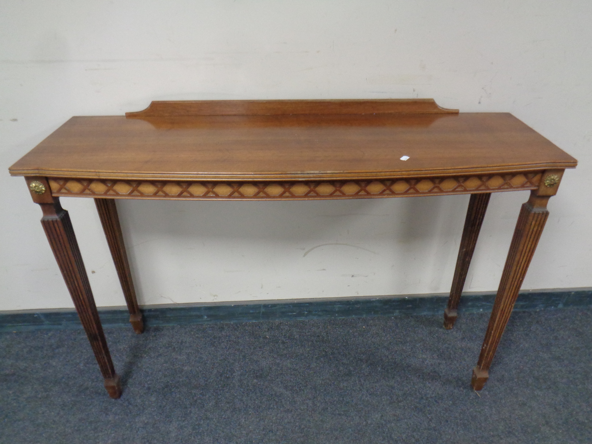 A reproduction mahogany bowfront hall table