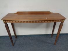 A reproduction mahogany bowfront hall table