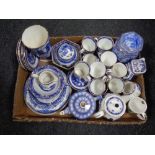 A box containing a large quantity of Ringtons china to include willow patterned tea ware, caddies,