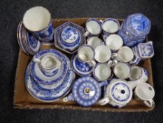 A box containing a large quantity of Ringtons china to include willow patterned tea ware, caddies,