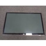 An LG 50" LCD TV with lead and remote and wall mounting bracket