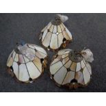 A set of three leaded glass light shades