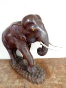 A carved hardwood figure of an elephant.