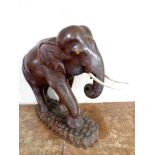 A carved hardwood figure of an elephant.