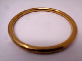 A 9ct gold circular bangle (dented) CONDITION REPORT: 11.