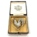 A fine quality antique diamond brooch modelled as a cockerel, set with red stones,