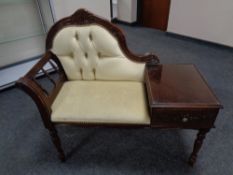 A reproduction mahogany telephone seat