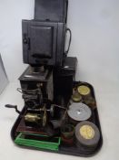 A tray containing a magic lantern with slides,