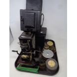 A tray containing a magic lantern with slides,