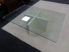 A contemporary rectangular glass coffee table