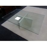 A contemporary rectangular glass coffee table