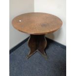 A copper topped circular coffee table