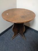 A copper topped circular coffee table