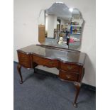 A walnut mirror back dressing table