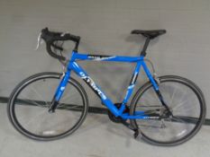 An Olympus Road Ace road bike.