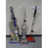 A Dyson DC3 upright vacuum together with a VAX Air3 upright vacuum and a G Tech cordless carpet