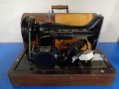 A 20th century Singer sewing machine in case (electrified).