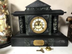 A late 19th century black slate and marble mantel clock by the Ansonia Clock Company with brass