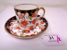 A Royal Crown Derby Imari pattern coffee cup and saucer set.