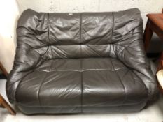 A 20th century brown leather two seater settee.