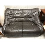 A 20th century brown leather two seater settee.