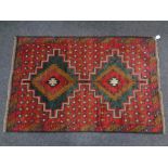 A Baluchi rug 138cm by 92cm